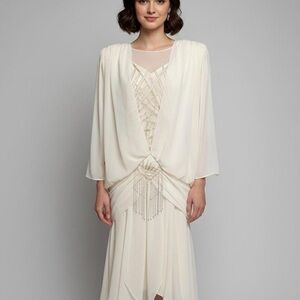 Vintage cream-colored draped dress with beaded detailing.
